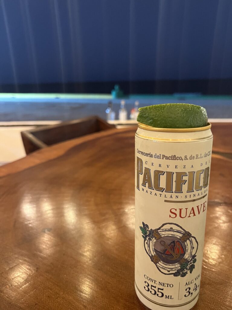 Beer picture in front of beach on Isla Mujeres.